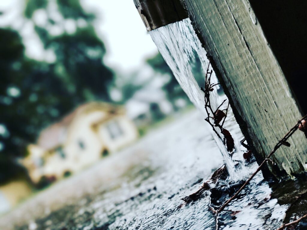 Complete Gutter Cleaning Near Me in Ocala Guide for 2026 Homeowners 2 clogged downspout before and after gutter cleaning