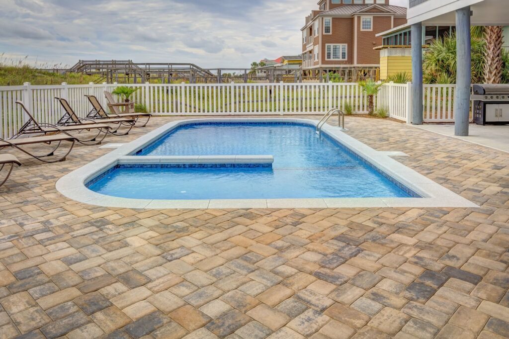 patio and pool deck cleaning near a driveway in Ocala FL