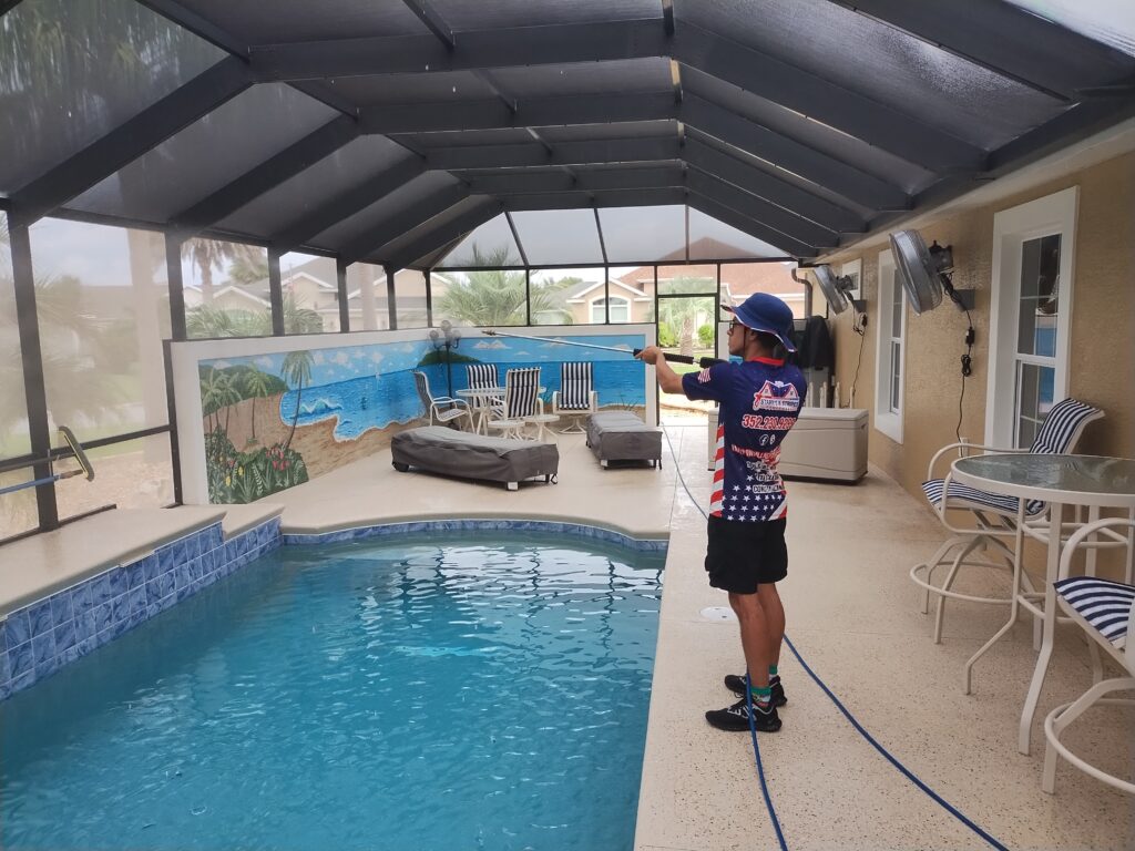 technician performing no pressure pressure washing on a Marion County home's siding